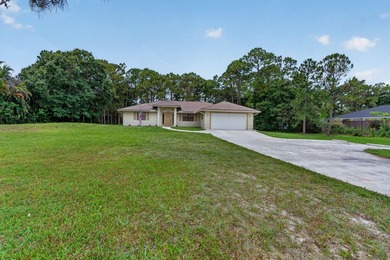 Enjoy peaceful country living in Jupiter Farms with this - photo 3