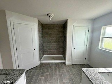 Now under Construction in NW Cape Coral a 4 Bed /3 Bath / 3 Car - photo 11