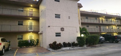 Lake Condo For Sale in Palm Springs, Florida