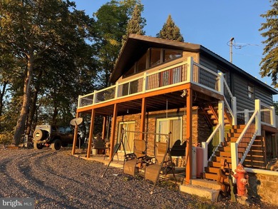 REDUCED!!! PRICE FIRM! This cabin is uniquely perched atop a - photo 12