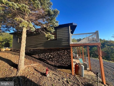 REDUCED!!! PRICE FIRM! This cabin is uniquely perched atop a - photo 13