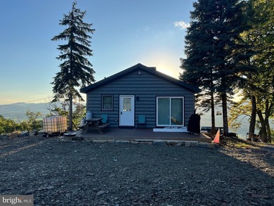 REDUCED!!! PRICE FIRM! This cabin is uniquely perched atop a - photo 24