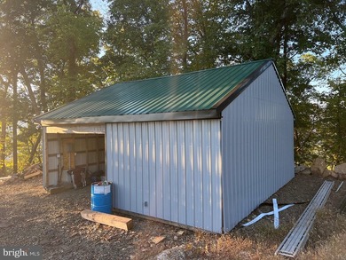 REDUCED!!! PRICE FIRM! This cabin is uniquely perched atop a - photo 25