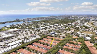Nestled in the highly sought-after Tequesta Oaks community, this - photo 1