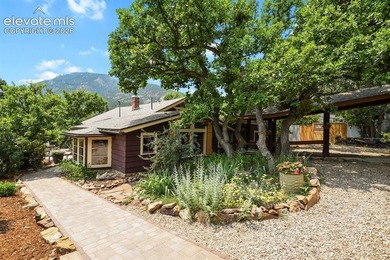 Nestled in the heart of desirable Cheyenne Canyon, this - photo 1