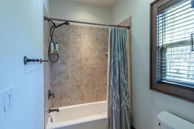 Nestled on a private cove of pristine Bear Creek Lake in the - photo 16