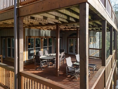 Nestled on a private cove of pristine Bear Creek Lake in the - photo 22
