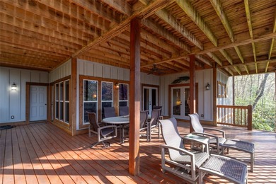 Nestled on a private cove of pristine Bear Creek Lake in the - photo 32