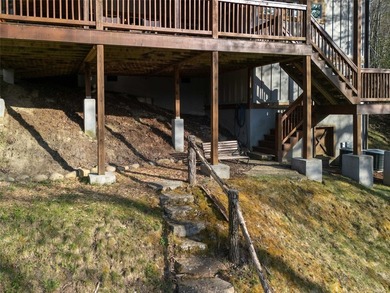 Nestled on a private cove of pristine Bear Creek Lake in the - photo 34