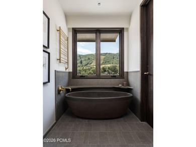 Experience the pinnacle of mountain living in this impeccably - photo 12