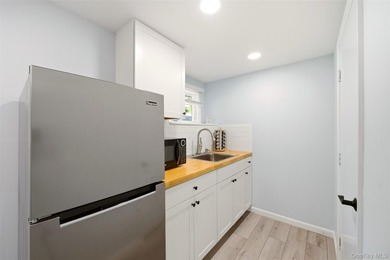 Nestled on a quiet, tree-lined cul-de-sac in Northport, this - photo 26