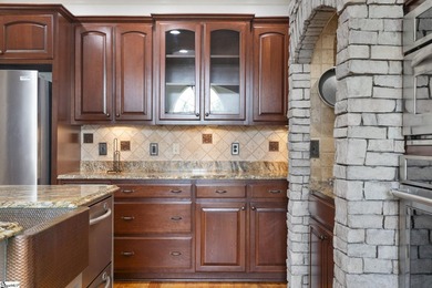 This Tuscan-inspired residence is a rare expression of - photo 17