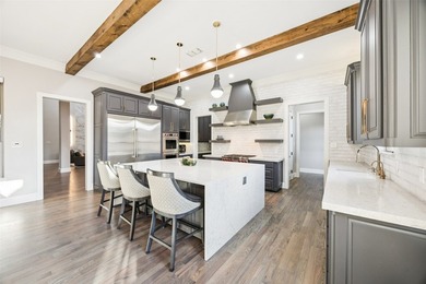 Nestled on a sprawling 1.229-acre lot within the prestigious - photo 11