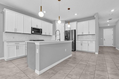 Welcome to this two-story residence located in Fields in Lake - photo 5