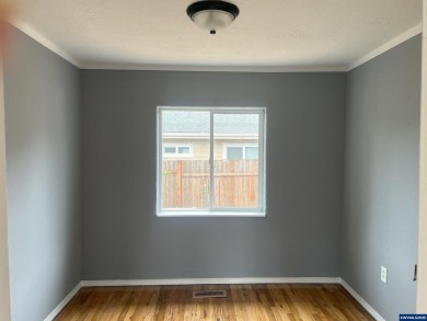 0.13 acre, fully chain link fenced 100x56 yard. 4 bedrooms, 2