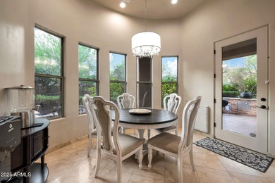 Positioned on an elevated, double-gated homesite within the