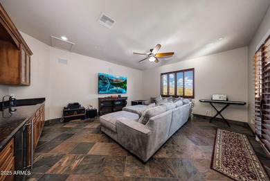 Positioned on an elevated, double-gated homesite within the