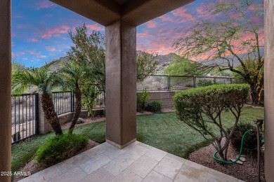 Positioned on an elevated, double-gated homesite within the