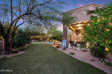 Positioned on an elevated, double-gated homesite within the