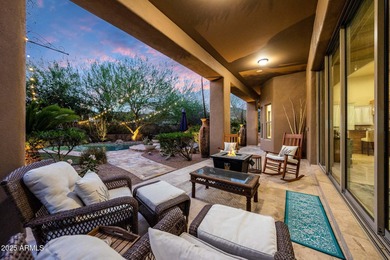 Positioned on an elevated, double-gated homesite within the