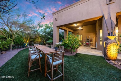 Positioned on an elevated, double-gated homesite within the