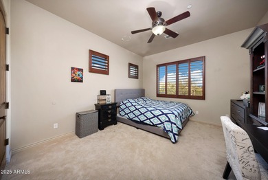 Positioned on an elevated, double-gated homesite within the