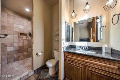 Positioned on an elevated, double-gated homesite within the