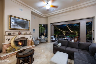 Positioned on an elevated, double-gated homesite within the