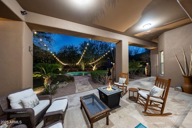 Positioned on an elevated, double-gated homesite within the