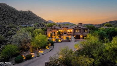 Positioned on an elevated, double-gated homesite within the