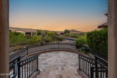 Positioned on an elevated, double-gated homesite within the