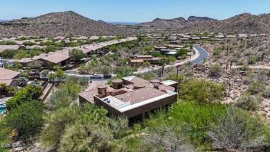 Positioned on an elevated, double-gated homesite within the