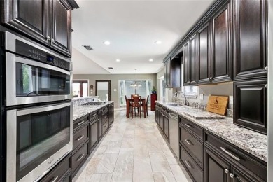 A true waterfront paradise on a rare triple lot in Venetian