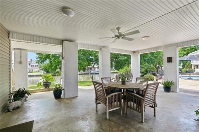 A true waterfront paradise on a rare triple lot in Venetian