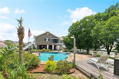 A true waterfront paradise on a rare triple lot in Venetian