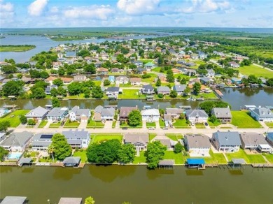 A true waterfront paradise on a rare triple lot in Venetian
