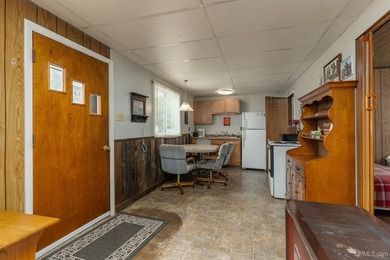 This charming four-unit resort on Lake Emily boasts 2,276 square - photo 14