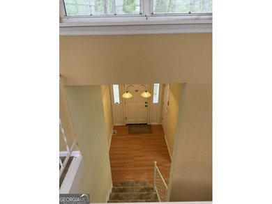 This metal roofed octagon home is in a protected cove off the - photo 5