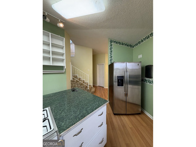 This metal roofed octagon home is in a protected cove off the - photo 7
