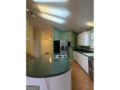 This metal roofed octagon home is in a protected cove off the - photo 10