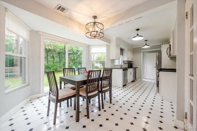 Welcome to this sunlit all brick center hall colonial located in - photo 12