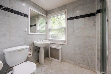 Welcome to this sunlit all brick center hall colonial located in - photo 20