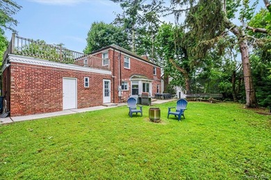 Welcome to this sunlit all brick center hall colonial located in - photo 24