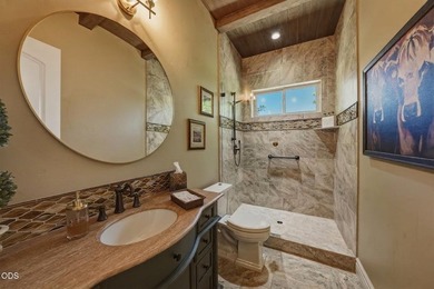 Overlooking the 13th tee in Tetherow, this exceptional home - photo 28