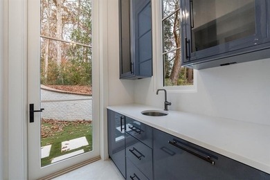 Tucked away on a private corner along a tree-lined cul-de-sac - photo 49