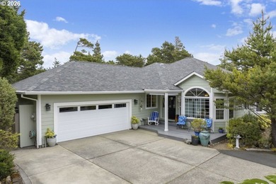 Tucked away & private on a wooded knoll in Heceta South, this - photo 1