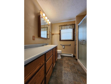 This sunny, well-landscaped ranch is located in-town in a