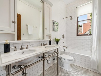 Nestled in the heart of Chicago's prestigious Gold Coast, this - photo 23
