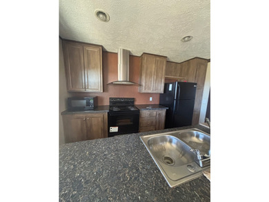 Spacious 4BR/2BA home situated on a 0.69-acre lot offering - photo 8