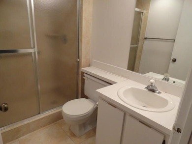 BRIGHT AND SPACIOUS second floor condo, tiled throughout - photo 11